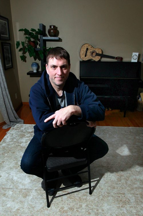 PHIL HOSSACK / WINNIPEG FREE PRESS - Jeff Robson poses in his Westwood living room also known as "the Sunset Saloon". Robson and his wife host House Concerts at their home. See Erin L's story. January 4, 2019