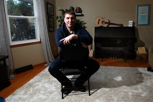 PHIL HOSSACK / WINNIPEG FREE PRESS - Jeff Robson poses in his Westwood living room also known as "the Sunset Saloon". Robson and his wife host House Concerts at their home. See Erin L's story. January 4, 2019