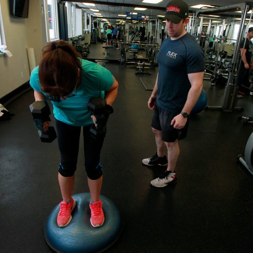 PHIL HOSSACK / WINNIPEG FREE PRESS - Alastair Hopper, personal trainer and owner of Flex Fitness works with client Barb Harvey in his gym Saturday. See story. January 5, 2019