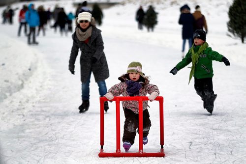 PHIL HOSSACK / WINNIPEG FREE PRESS - Sophia Hoeppner (5) sets a blistering pace as mom Mengchen and brother Edwin (7) try to keep up along the Fork's RIver Trail Saturday. See story. January 5, 2019