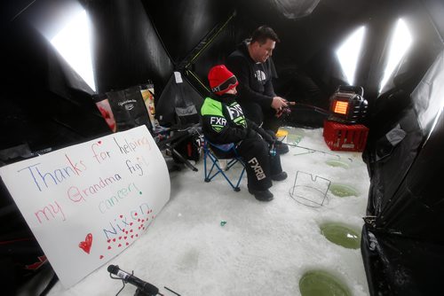 JOHN WOODS / WINNIPEG FREE PRESS
Tyson Buskell  and his son Nixon fish beside the sign Nixon made for his grandma Kim at KidFish Ice Derby in Selkirk in support of The Children's Hospital Foundation and CancerCare Manitoba Foundation Sunday, January 6, 2019.