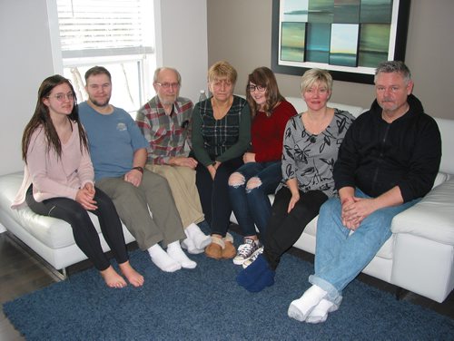 Canstar Community News Jan. 3, 2019 - The Harris family is recovering after their Oak Bluff home was totally destroyed in a fire on Dec. 20. (From left) Meagan Harris, Travis, Gary and Linds Kruger, Mikayla, Christina and Gerald Harris are shown in the Winnipeg home the Harrises are temporarily renting. (ANDREA GEARY/CANSTAR COMMUNITY NEWS)