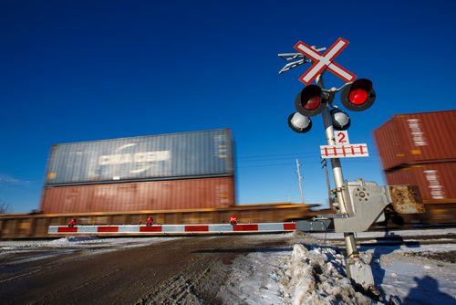 MIKE DEAL / WINNIPEG FREE PRESS
A train crosses Community Row close to Wilkes Avenue Monday afternoon.
190107 - Monday, January 07, 2019.