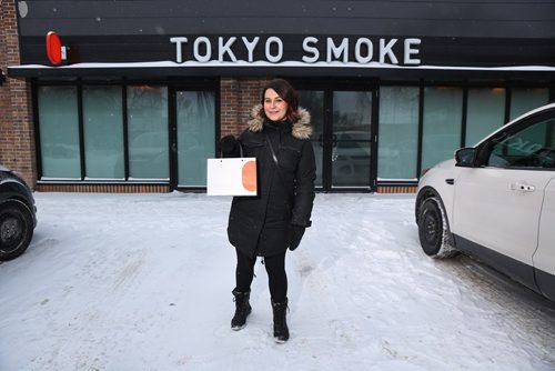 MIKE DEAL / WINNIPEG FREE PRESS
Jen Zoratti outside Tokyo Smoke in Osborne Village while doing a first-person story on the experience of buying pot. 
190108 - Tuesday, January 8, 2019