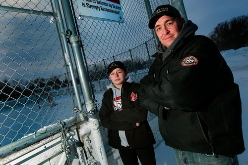 PHIL HOSSACK / WINNIPEG FREE PRESS -  Glenn Grove and his daughter Trinity (15yrs) pose at the community skating rink across from their St Andrews home Tuesday. Trinity was kicked off the rink after discovering there was a new$60 fee instituted ast the community centre's outdoor facility. - January 8, 2019.