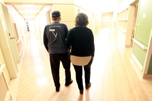 PHIL HOSSACK / WINNIPEG FREE PRESS - Kerri Peskach walks the halls at the care facility in Selkirk with her father Terry Law, he lives in the long term care facility due to dementia. Joel Schlessinger's story. January 8, 2019