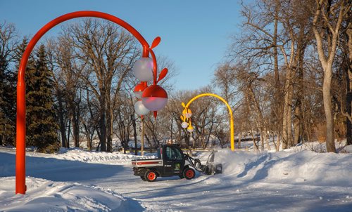 MIKE DEAL / WINNIPEG FREE PRESS
City crews hard at work clearing snow from around the frozen pond at Kildonan Park Wednesday morning. The official opening of Bokeh,  an artwork partnership with Takashi Iwasaki and Nadi Design, will be lit up during a party at the Kildonan Park Pond this Saturday (January 12, 2019) evening with a family skating party from 5 - 7:30pm. The opening will include music from DJ Mama Cutsworth and DJ Hunnicutt. 
190109 - Wednesday, January 09, 2019.