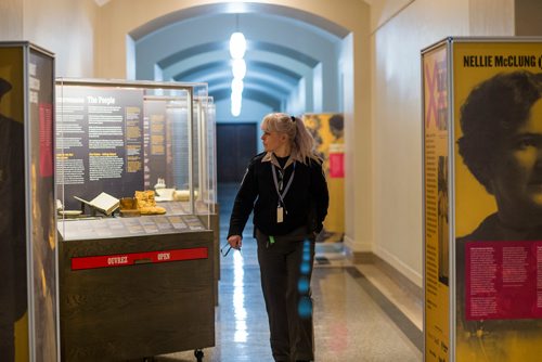 MIKAELA MACKENZIE / WINNIPEG FREE PRESS
Roxanne Campbell walks past a travelling Manitoba Museum exhibition, "Nice Women Don't Want the Vote," in the basement of the Manitoba Legislative Building in Winnipeg on Wednesday, Jan. 9, 2019. 
Winnipeg Free Press 2018.