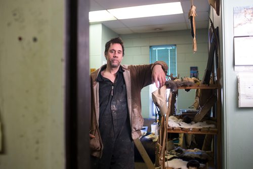 MIKAELA MACKENZIE / WINNIPEG FREE PRESS
Carl Froese, owner of Manitoba Buckskin, poses for a portrait in his workspace after being robbed of traditional family heirlooms (from this shelf) and shop equipment overnight in Winnipeg on Wednesday, Jan. 9, 2019. 
Winnipeg Free Press 2018.