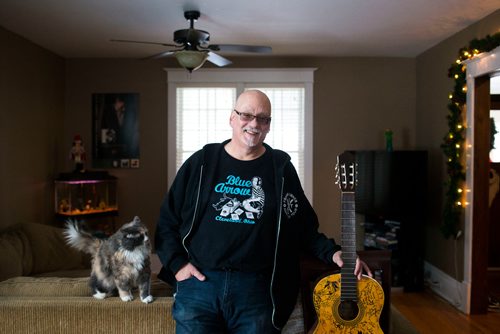 MIKAELA MACKENZIE / WINNIPEG FREE PRESS
Stu Reid poses for a portrait in the "Stu Dome," also known as his living room, where he hosts frequent house concerts in Winnipeg on Thursday, Jan. 10, 2019. The guitar has been signed by all of the performers he's had in his home (the strings had to be taken off to make room for more signatures).
Winnipeg Free Press 2018.