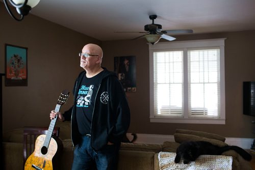 MIKAELA MACKENZIE / WINNIPEG FREE PRESS
Stu Reid poses for a portrait in the "Stu Dome," also known as his living room, where he hosts frequent house concerts in Winnipeg on Thursday, Jan. 10, 2019. The guitar has been signed by all of the performers he's had in his home (the strings had to be taken off to make room for more signatures).
Winnipeg Free Press 2018.