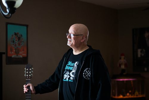 MIKAELA MACKENZIE / WINNIPEG FREE PRESS
Stu Reid poses for a portrait in the "Stu Dome," also known as his living room, where he hosts frequent house concerts in Winnipeg on Thursday, Jan. 10, 2019. The guitar has been signed by all of the performers he's had in his home (the strings had to be taken off to make room for more signatures).
Winnipeg Free Press 2018.