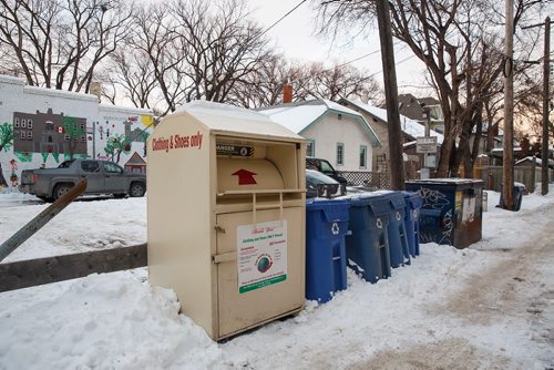 MIKE DEAL / WINNIPEG FREE PRESS
A Global Recycling and AID Inc. donation bin sits across the street from Ecole Laura Secord School on Wolseley Avenue. 
190110 - Thursday, January 10, 2019.