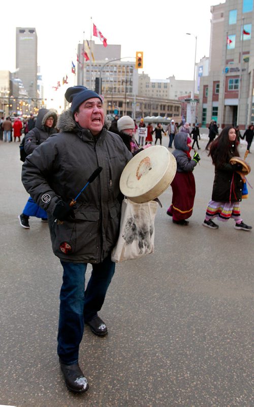 PHIL HOSSACK / WINNIPEG FREE PRESS - A protestor sings drums and dances at Portage and Main Thursday. See Kevin Rollason's story.  January 10, 2019