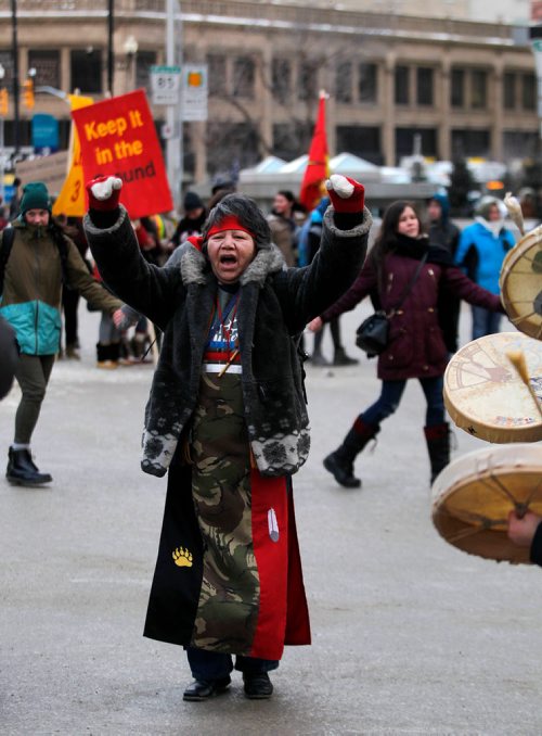 PHIL HOSSACK / WINNIPEG FREE PRESS - Protest organizer Alma Kakikepinace dances in the middle of Portage and Main Thursday. See Kevin Rollason's story. January 10, 2019