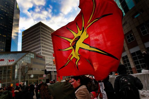 PHIL HOSSACK / WINNIPEG FREE PRESS - Protestors fly the AIM flag at Portage and Main Thursday. See Kevin Rollason's story.  January 10, 2019