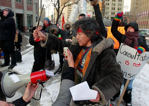 PHIL HOSSACK / WINNIPEG FREE PRESS - Protest organizer Alma Kakikepinace speaks to the rally at Portage and Main Thursday. See Kevin Rollason's story.  January 10, 2019