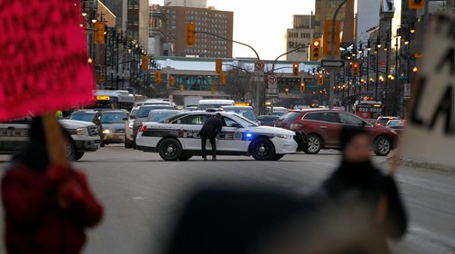 PHIL HOSSACK / WINNIPEG FREE PRESS - Protestors dance at Portage and Main Thursday while police divert rush hour traffic. See Kevin Rollason's story. January 10, 2019