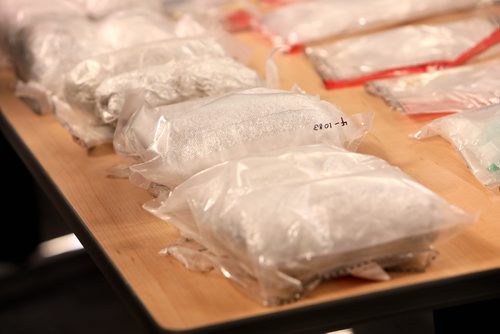 RUTH BONNEVILLE / WINNIPEG FREE PRESS

Photo of a row of 1 Kg  bags of Methamphetamine, each with a street value $100,000, taken during press conference with Winnipeg Police Inspector Max Waddell at the WPS HQ, Friday.  

A total of 10, 1 KG bags of meth, were seized by the  Winnipeg Police Drug Enforcement and Street Crime Unit  in the last 50 days.   Along with the meth were other drugs including fentanyl and heroin.  The total street value of the drugs is estimated to be over $1,014 000. 

Note: One bag of meth has the potential of creating a high that could last days for over 100 000 people.



Photos taken during press conference with Winnipeg Police Inspector Max Waddell at the WPS HQ Friday.  



Jan 11th, 2019 

