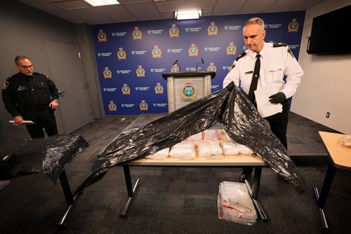 RUTH BONNEVILLE / WINNIPEG FREE PRESS

Winnipeg Police Inspector, Max Waddell, uncovers the 2nd of 3 tables of drugs that were seized in the last 50 days by the Winnipeg Police Drug Enforcement and Street Crime Unit at WPS HQ during press conference, Friday.  

On the 3 tables are 10, 1 Kg bags of Meth with a street value $100,000.  One bag of meth has the potential of creating a high that could last days for over 100 000 people. Other drugs are also on the table including fentanyl and heroin with a total street value of the drugs seized being over $1,014 000. 



Jan 11th, 2019 

