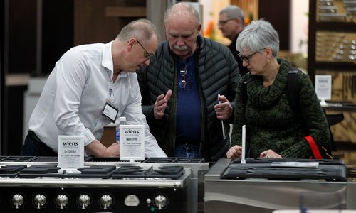 PHIL HOSSACK / WINNIPEG FREE PRESS - Wiens Furniture of Niverville gives the ow down on a new gas range to a pair of potential clients Friday at the RBC Convention Centre's Reno Show. See releaseJanuary 11, 2019