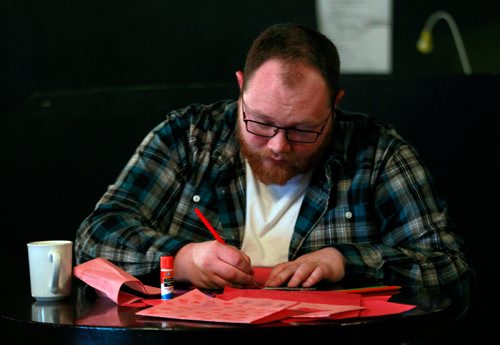 PHIL HOSSACK / WINNIPEG FREE PRESS - Cole Swier works away as group of men and boys in Winnipeg Make  Valentine's Day cards for women in shelters. This is the third consecutive year they've done it. It's happening at the Good Will Social Club, See release.  January 12, 2019