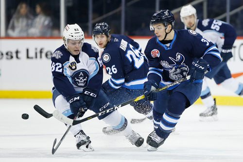 JOHN WOODS / WINNIPEG FREE PRESS
Manitoba Moose Alexis D'Aoust (32) defends against Milwaukee Admirals' Zach Magwood (82) during first period AHL action in Winnipeg on Monday, January 14, 2019.