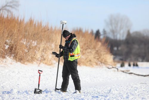 RUTH BONNEVILLE / WINNIPEG FREE PRESS

Weather standup.
A worker for an engineering firm checks the depth of the Assiniboine River after drilling through the ice just east of Assiniboine Park for the City of Winnipeg Wednesday. 

Jan 16th, 2019 
