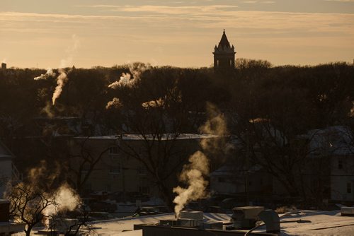 MIKE DEAL / WINNIPEG FREE PRESS
The steeple of the Young United Church rises through the winter canopy of trees as seen from the roof of the Winnipeg Art Gallery Wednesday afternoon.
190116 - Wednesday, January 16, 2019.