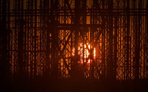 PHIL HOSSACK / WINNIPEG FREE PRESS - Warm end to a cold day - STANDUP - The setting sun seen through masts at Manitoba Hydo's Riel Converter Station east of Winnipeg on Highway #207 (Deacon Road) -January 17, 2019.