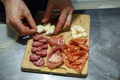 MIKE DEAL / WINNIPEG FREE PRESS
Carbone Club Cafe
260 St Mary Ave
Preparing a Charcuterie Board which contains: parmesan cheese, brie cheese, calabrese Salami, cured Salumi, herbed Ricotta with honey, and olive Tapenade.
190118 - Friday, January 18, 2019.