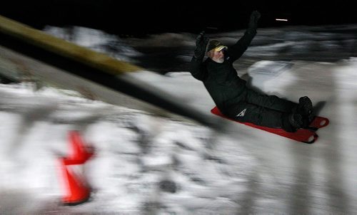 PHIL HOSSACK / WINNIPEG FREE PRESS - Marci Beaucage (The Ice Man) tests his toboggan run at the Roblin Park Community Centre Friday night. Mstci builds a pair of toboggan runs and maintains the ice surface at the CHarleswood Community Centre and was expecting more to show up despite the frigid temps for their annual Winter Festival. January 7, 2019.