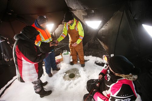 JOHN WOODS / WINNIPEG FREE PRESS
Mike and Kathleen Melnychuk, Angling and events coordinator for the Manitoba Wildlife Federation, right, teach ice fishing to Eunice and Dennis Morante during Winterfest at Fort Whyte Alive in Winnipeg  Sunday, January 20, 2019.