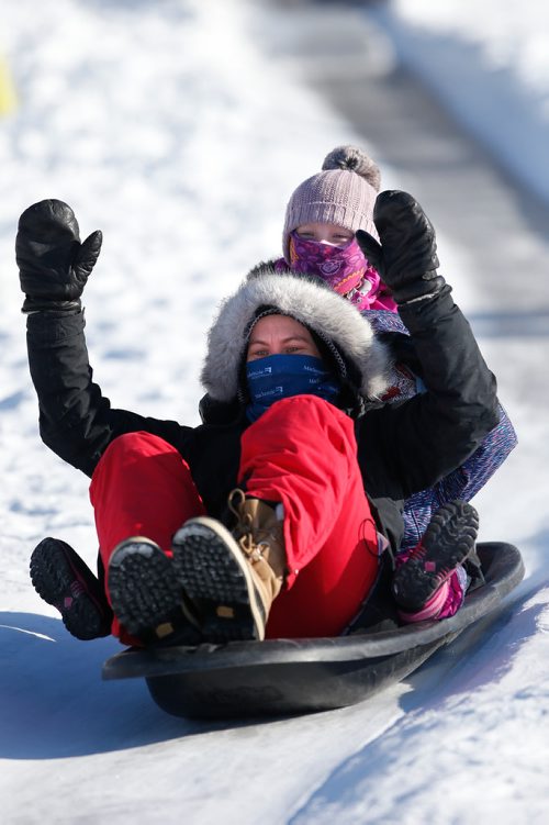 JOHN WOODS / WINNIPEG FREE PRESS
Kaitlan Knowles and her daughters Madeline and Ginny slide down a toboggan run during Winterfest at Fort Whyte Alive in Winnipeg  Sunday, January 20, 2019.
