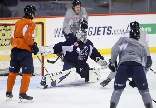 TREVOR HAGAN / WINNIPEG FREE PRESS
Manitoba Moose goaltender Eric Comrie (1) during practice at Bell MTS Place, Monday, January 21, 2019.