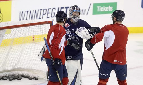 TREVOR HAGAN / WINNIPEG FREE PRESS
Manitoba Moose goaltender Eric Comrie (1) middle, with Cameron Schilling (5) and Logan Shaw (38) during practice at Bell MTS Place, Monday, January 21, 2019.