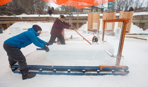 MIKE DEAL / WINNIPEG FREE PRESS
Snow carver, Jodi Pratt (left) helps Earl Dyck use a specially made frame that helps ice carvers cut large blocks for use at the Festi-Bar on Ice which opens January 23rd and is hosted by the Festival du Voyageur at The Forks.
190121 - Monday, January 21, 2019.