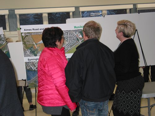 Canstar Community News Jan. 14, 2019 - Manitoba Infrastructure director Erica Vido (at right) explains one of the maps displayed at the South Perimeter Highway design study public open house at South Winnipeg Community Centre on Jan. 14. (ANDREA GEARY/CANSTAR COMMUNITY NEWS)