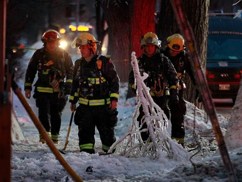 PHIL HOSSACK / WINNIPEG FREE PRESS - City firefighters trudge through ice buildup in front of a three story apartment building during a mop up operation Monday. A second fire in the building in a week closed Maryland Street during the afternoon rush hour.-January 21, 2019. 

Note Also I photographed another serious fire at the same location a year maybe 2 ago......not sure of the date, there were injuries then and photos of at least one being taken away.
