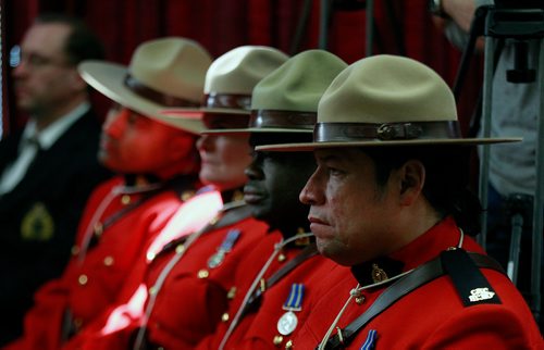 PHIL HOSSACK / WINNIPEG FREE PRESS - RCMP members in Red Serge watch as Eagle Feathers at "D" Division went through ceremony preparing them to be placed in Detachments across Manitoba. Alex Paul story. - January 7, 2019.