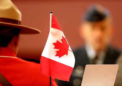 RUTH BONNEVILLE / WINNIPEG FREE PRESS


Generic Stock type photo of Canadian flag with back of RCMP officer in uniform taken at Citizenship ceremony Tuesday.


Generic citizenship ceremony photo. 


January 22nd, 2019
