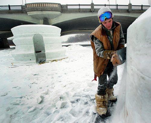 PHIL HOSSACK / WINNIPEG FREE PRESS - Snow Sculptor Jakobi Heinrichs puts the finishing touches on one of Architect Michael Maltzan's WAG Inuit Art Centre warming huts on the Red River Wednesday. See story. January 23, 2019
