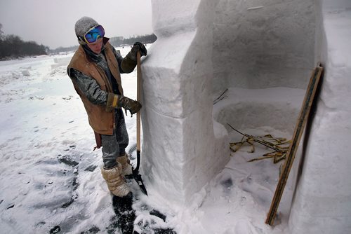 PHIL HOSSACK / WINNIPEG FREE PRESS - Snow Sculptor Jakobi Heinrichs puts the finishing touches on one of Architect Michael Maltzan's WAG Inuit Art Centre warming huts on the Red River Wednesday. See story. January 23, 2019