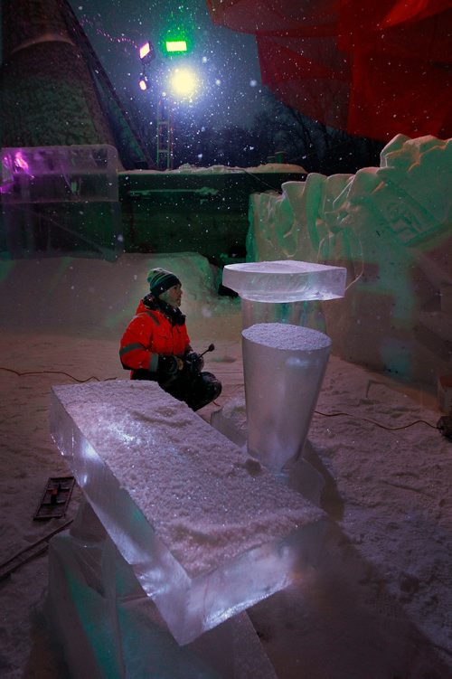 PHIL HOSSACK / WINNIPEG FREE PRESS - Luca Roncoroni puts the finishing touches on a set of luminescent bar tables at the opening night of the Ice Bar on the Red River Wednesday. Luca hails originally from Italy, now lives in Norway and makes the trip to Winnipeg every year to work on the trail's Warming Huts and features. See story. January 23, 2019