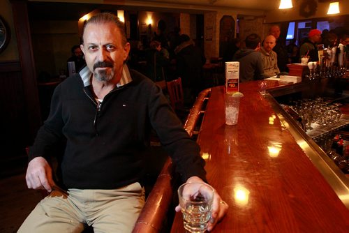 PHIL HOSSACK / WINNIPEG FREE PRESS - Wee Johnny's  owner John Giannakis sits at the bar in his basement comedy club under his restaurant Johnny G's. See story. January 23, 2019