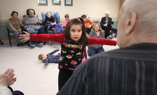 RUTH BONNEVILLE / WINNIPEG FREE PRESS

Sunday Special, Feature on  - Seniors and kids music class. 

Photo of Shoni (4yrs), showing resident Roland (Rolly), Remillard how she can dance during music class.  

Daycare kids (ages 3 & 4), from Prairie Children's Centre, and residents of Pembina Place Personal Care Home, both located at the Deaf Centre Manitoba on Pembina,  meet weekly for 30 minute music class.  

Music teacher and chaplain, Michele Barr,
leads kids into playing bells and drums and other percussion instruments, as well as dancing with ribbons and scarfs during interactive music class Friday.  The children take part in the class in the centre as the adults from the centre watch and participate.



See Brenda Suderman's story. Story to run on a Sunday, Feb 4th. 

January 18th, 2019
