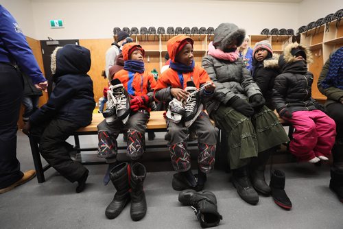 RUTH BONNEVILLE / WINNIPEG FREE PRESS

Story: The True North Youth Foundation  hosts the last of six 2018-19 Welcome to Winnipeg events where they welcome members of the Congo Canada Charity Foundation to experience winter sports at Camp Manitou on Saturday.  

Kids are outfitted with skating gear before heading out on the outdoor rink for their first time skating.  
 
January 26th,  2019
