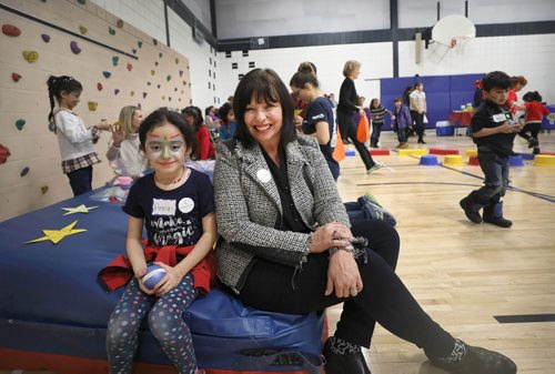RUTH BONNEVILLE / WINNIPEG FREE PRESS

Story: The Newcomer Community Hub,  located inside Ryerson School, hosts its grand opening Saturday. 

Photo of Susan Schmidt, Assistant Superintendent of the Pembina Trails School Div. sits amongst a group of kids playing at the  grand opening for the Hub  Saturday.  

Pembina Trails School Division has recently welcomed an increasing number of refugees into its schools. In order to support the community, with a current focus on Yazidi refugees, a unique relationship has been created with Immigration Partnership Winnipeg, the Manitoba Association of Newcomer Serving Organizations and a number of other groups called, The Newcomer Community Hub.   It is located in Ryerson School in Pembina Trails School Division and is a one-stop shop of services that traditionally have been located in the citys downtown.   The Newcomer Community Hub held its formal grand opening with food, activities for kids and ribbon cutting ceremony.  

See Solomon's story. 
 
January 26th,  2019

