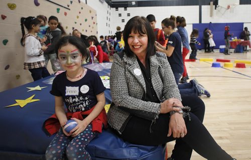 RUTH BONNEVILLE / WINNIPEG FREE PRESS

Story: The Newcomer Community Hub,  located inside Ryerson School, hosts its grand opening Saturday. 

Photo of Susan Schmidt, Assistant Superintendent of the Pembina Trails School Div. sits amongst a group of kids playing at the  grand opening for the Hub  Saturday.  

Pembina Trails School Division has recently welcomed an increasing number of refugees into its schools. In order to support the community, with a current focus on Yazidi refugees, a unique relationship has been created with Immigration Partnership Winnipeg, the Manitoba Association of Newcomer Serving Organizations and a number of other groups called, The Newcomer Community Hub.   It is located in Ryerson School in Pembina Trails School Division and is a one-stop shop of services that traditionally have been located in the citys downtown.   The Newcomer Community Hub held its formal grand opening with food, activities for kids and ribbon cutting ceremony.  

See Solomon's story. 
 
January 26th,  2019

