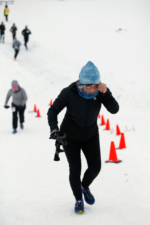 JOHN WOODS / WINNIPEG FREE PRESS
Christy Miyanishi climbs a river bank as she comes off the Red River as part in the 6th annual Frostbite River Run, a fundraiser in support of programming and activities at Riverview Community Centre in WinnipegSunday, January 27, 2019. The Frostbite River Run is part of the Riverview Winter Classic - a series of outdoor events held in January at the community centre.